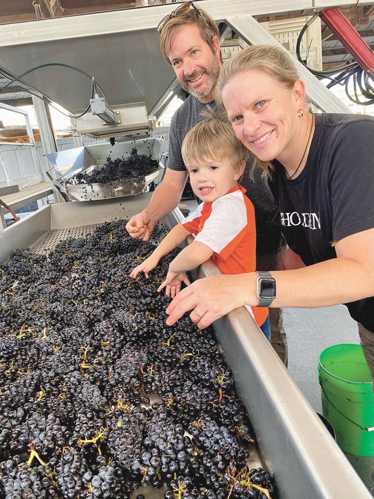 Wynne Peterson-Nedry, owner and winemaker at Ridgecrest Wines, sorting fruit with her son and husband. ## Photo provided by Ridgecrest