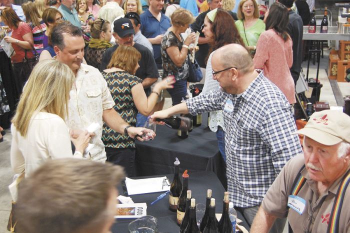 Mike Merriman, of Merriman Wines, pours samples for eager tasters at the Yamhill Carlton tasting hosted at Anne Amie. Photo by Hilary Berg. Mike Merriman, of Merriman Wines, pours samples for eager tasters at the Yamhill Carlton tasting hosted at Anne Amie. Photo by Hilary Berg.