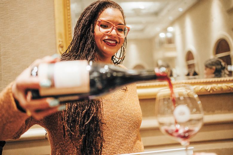 Tiquette Bramlett, founder of nonprofit Our Legacy Harvested, pours wine while raising awareness of her organization s mission to educate, advance and empower the BIPOC community in the wine industry.##Photo provided by World of Pinot Noir