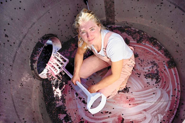 Madeline Rausch, winemaker at Bergström Wines, finishes cleaning a tank during the 2023 harvest.