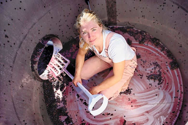 Madeline Rausch, winemaker at Bergström Wines, finishes cleaning a tank during the 2023 harvest. Madeline Rausch, winemaker at Bergström Wines, finishes cleaning a tank during the 2023 harvest.
