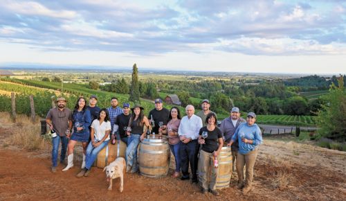 Members and graduates of the pEr From left; Miguel Lopez, AHIVOY co- founder, Red Dirt Vineyard Management and Wine Making; DeAnna Ornelas, AHIVOY president, Winderlea Vineyard and Winery tasting room and hospitality manager; Hector Cabrera, AHIVOY graduate, Argyle Winery equipment supervisor; Elena Rodriguez, AHIVOY Board of Directors, Alumbra Cellars president and winemaker; Adrian Mendoza, AHIVOY graduate, Northwest Wine Company vineyard supervisor, Alad Vineyard owner; Ivan George, AHIVOY graduate, Vitis Terra Vineyard Services assistant vineyard manager; Sofia Torres McKay, AHIVOY co-founder, Cramoisi Vineyard owner and winegrower; Sam Parra, AHIVOY co-chair, Parra Wine Co. proprietor;  Sonia Nieto Solano, AHIVOY graduate, Results Partners vineyard manager; Neal D. Hulkower, AHIVOY Board of Directors; Bryan Berenguer, AHIVOY Board of Directors, Human Cellars winemaker, Chemeketa Community College vineyard management instructor; Cristina Gonzales, AHIVOY secretary, Gonzales Wine Company winemaker and founder; Fermin Valdovinos, AHIVOY graduate, Four Diamonds vineyard supervisor and maintenance; Elizabeth Sánchez, AHIVOY graduate, Four Diamonds vineyard maintenance; plus Lava girl, Cramoisi Vineyard tasting room greeter and vineyard dog.