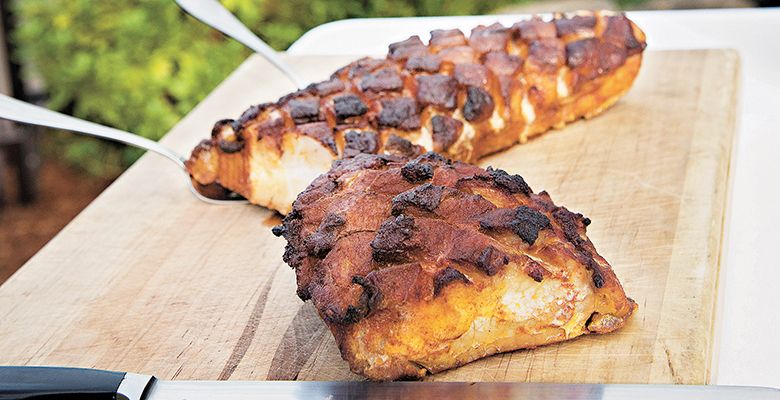 Guests enjoy chili-cured pork loin served with black eyed pea salsa at the Blakeslee event.