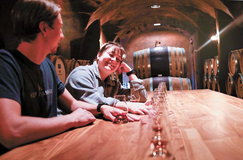 Co-lead distillers Jackson Harloff and Tatum Frey blending spirits in the barrel cave.##Photo provided