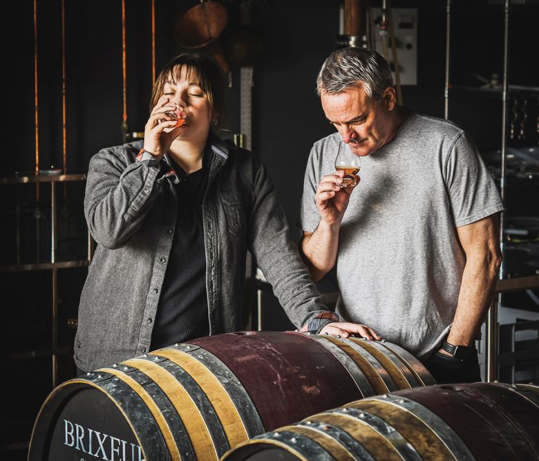 Daughter (Tatum Frey) and father (James Frey) sampling Rye whiskey aging in seasoned Pinot Noir casks.##Photo provided