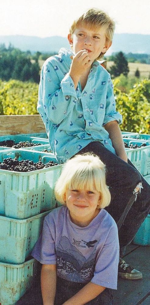 Brother Ian (top) and sister Wynne Peterson-Nedry helping during the 1987 grape harvest. ## Photo provided by Ridgecrest