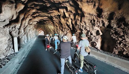 MountNbarrelL leads bicycle tours through the scenic Mosier Twin Tunnels. ##Photo provided by MountNbarrelL