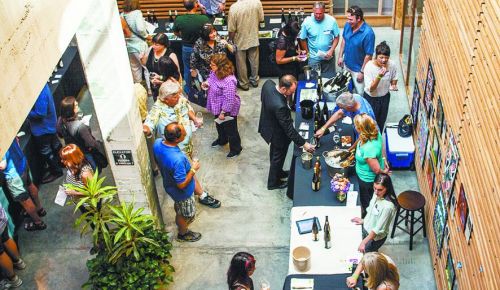Guests at the 2014 Riesling Invasion sample some wines from the 40 producers pouring at the event held at the Olympic Mills Building in Portland. ##Photo by Jeremy Fenske
