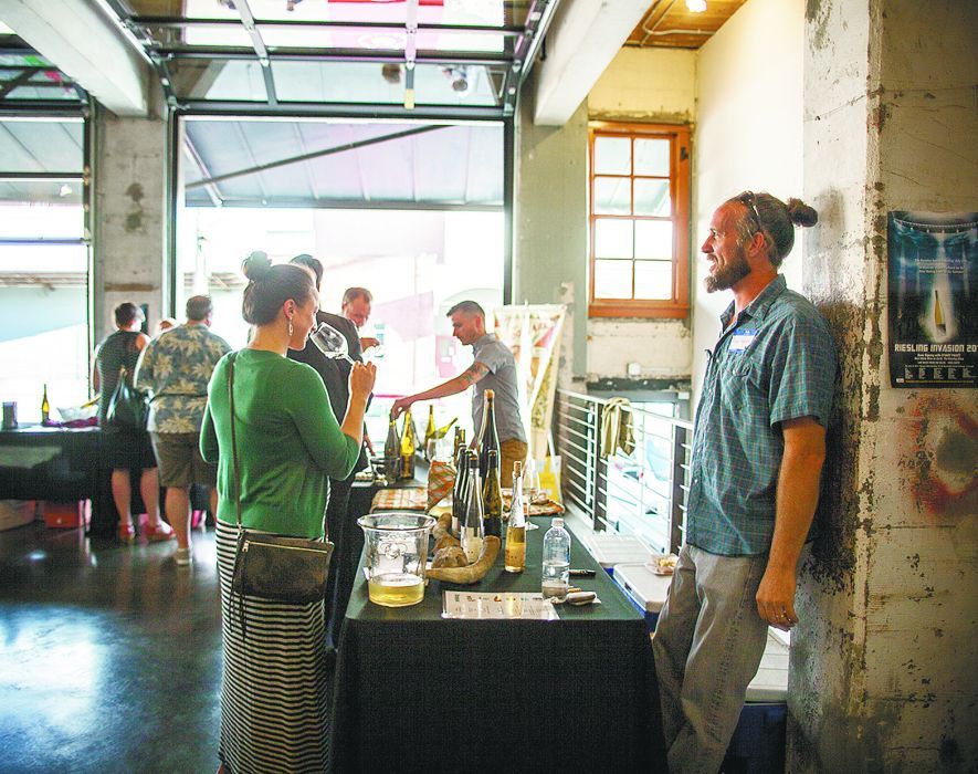 Brooks winemaker Chris Williams pours the Amity winery’s Rieslings for attendees at the urban event. ##Photo by Jeremy Fenske Brooks winemaker Chris Williams pours the Amity winery’s Rieslings for attendees at the urban event. ##Photo by Jeremy Fenske