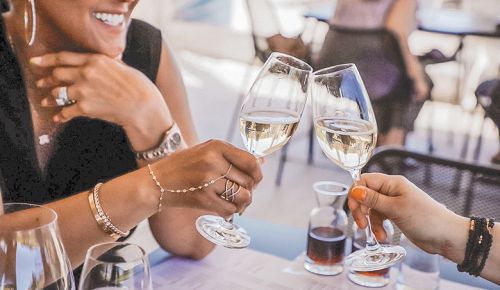 Two wine lovers click glasses filled with Stoller Estate Brut sparkling wine. ## Photo provided by Stoller Family Estate