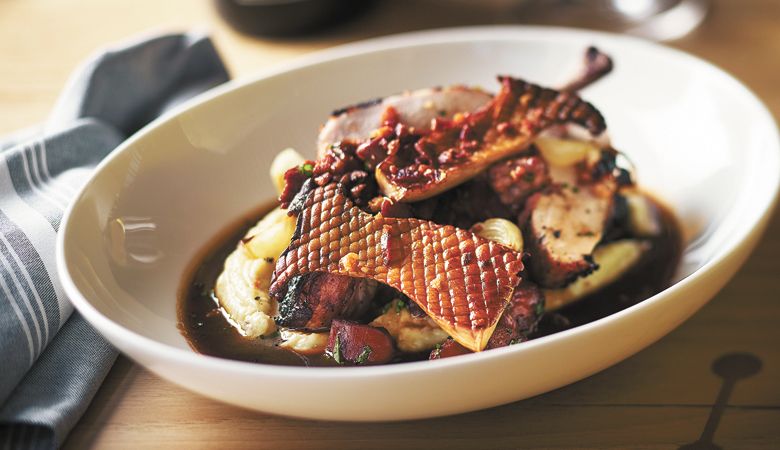 Roasted
red wine chicken
with potato
purée, roasted
mushrooms, pearl
onions, bacon and
roasted chicken
jus. ##PHOTO BY JOHN VALLS
