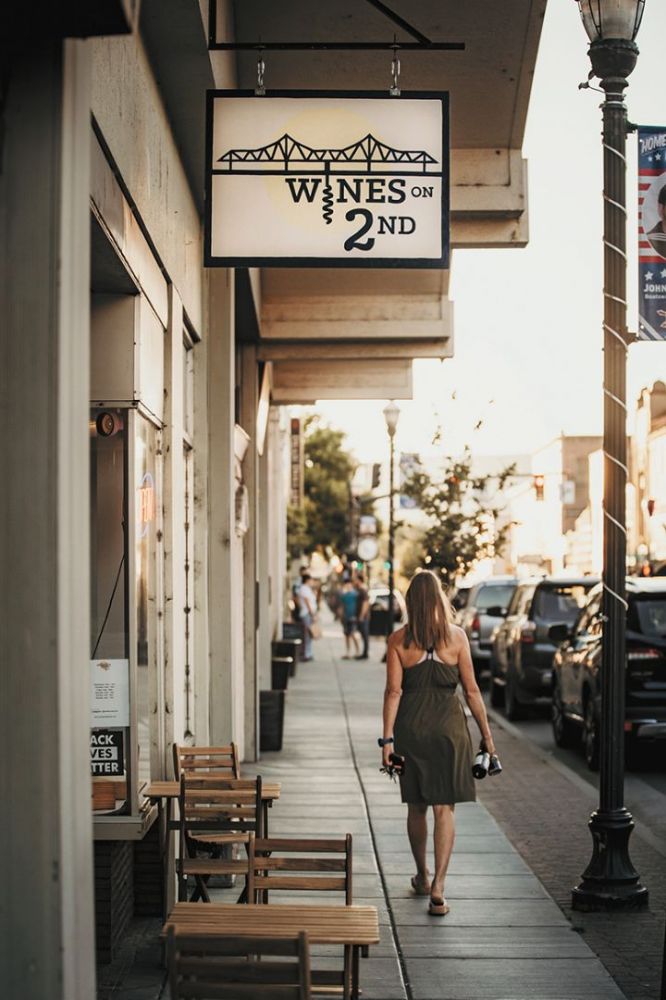 A customer leaving Wines on Second. ##Photo by Kathy Pothier A customer leaving Wines on Second. ##Photo by Kathy Pothier